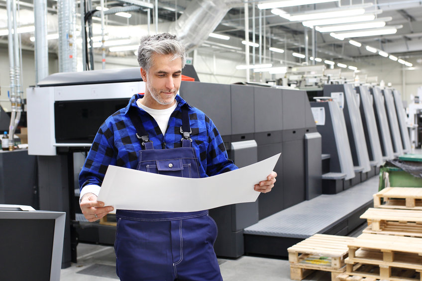 Offset printing. A printer with a printout sheet.
